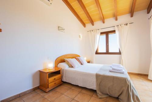 En eller flere senge i et værelse på Finca Roca Blanca