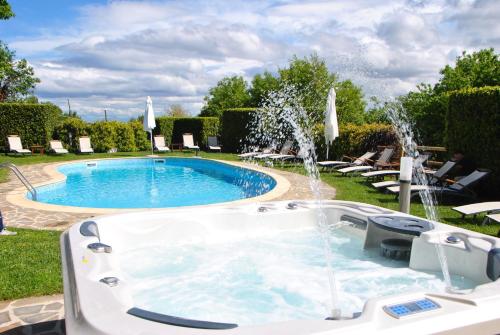 a swimming pool with a fountain in a yard at Villa La Ventana in Sant'Agnello