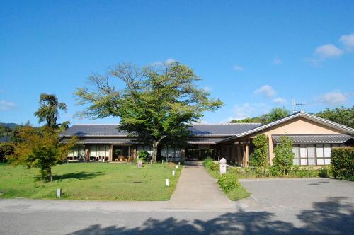 a house with a tree in front of it at Kyoto Utano Youth Hostel in Kyoto