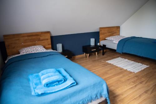 Postel nebo postele na pokoji v ubytování Na Zamkowej Apartament