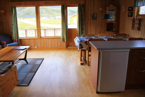 a kitchen with a table and a counter top at Nordkapp Camping in Honningsvåg