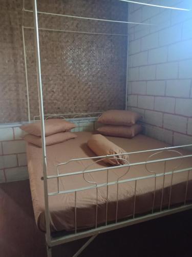a bunk bed with pillows on it in a room at Villa Daffa Ciwidey in Ciwidey