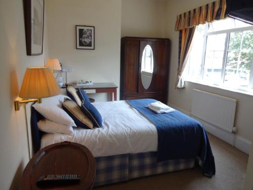 Katil atau katil-katil dalam bilik di The Hillmorton Manor Hotel