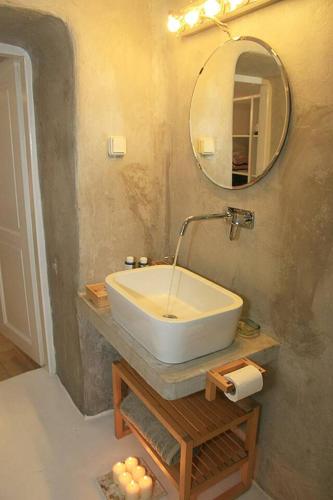 a bathroom with a sink and a mirror at The Pulse Residence Astypalea in Astypalaia
