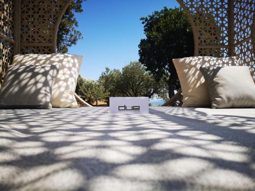 a bed with two pillows on top of it at Due Esperienza Panoramica in Lamezia Terme