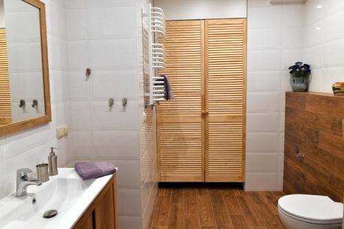 a bathroom with a toilet and a sink and a shower at ANGELS A in Zator