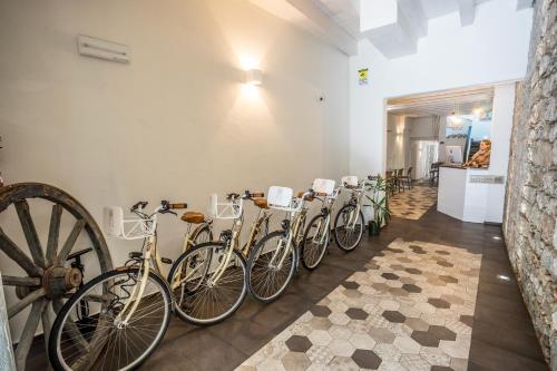 a row of bikes parked in a room at Aras Hotel Boutique in Villasimius