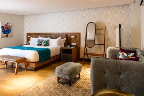 Säng eller sängar i ett rum på FCH Hotel Providencia