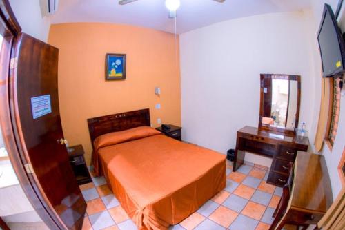 Cama o camas de una habitación en Hotel Los Girasoles