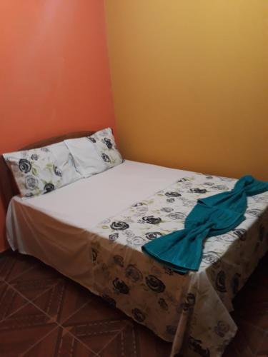 a small bed in a room with at Pousada da Vila in Vale do Capao