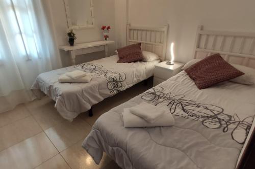 A bed or beds in a room at Canarian village house