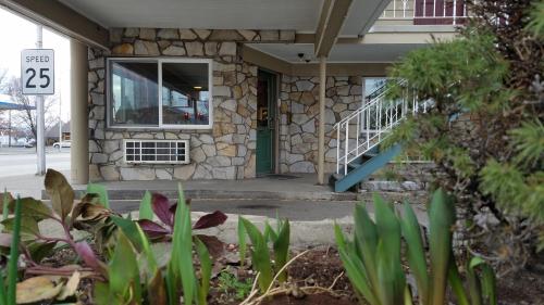 a stone building with a door with a window at Royal Motor Inn in La Grande