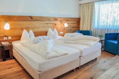 Postel nebo postele na pokoji v ubytování Hotel Seelos