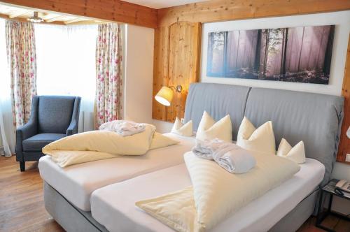 Postel nebo postele na pokoji v ubytování Hotel Seelos