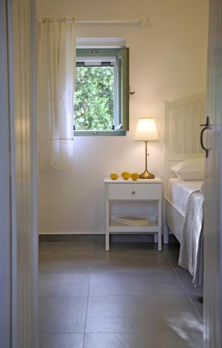 Ένα ή περισσότερα κρεβάτια σε δωμάτιο στο Mandarini House