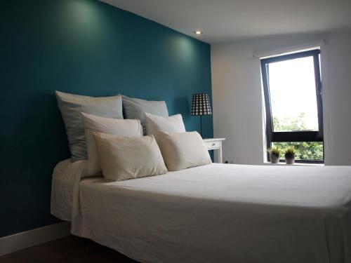 Llit o llits en una habitació de LOFTs BEDANDBEACH