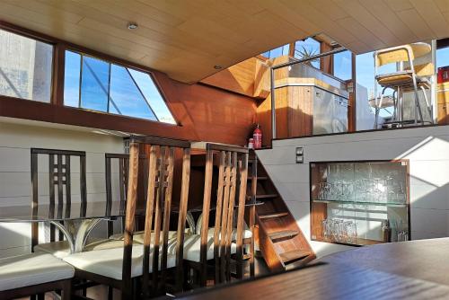 a staircase in a house with chairs and a fireplace at Le Bateau Ivre in Bordeaux