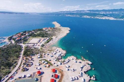 an aerial view of an island in the water at Botic Apartments in Šilo