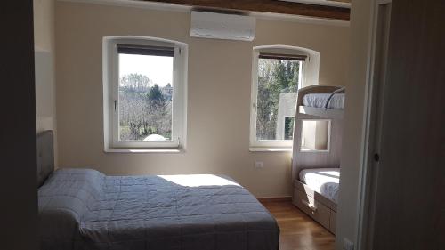 A bed or beds in a room at GARDAWORLD