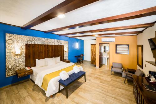 Postel nebo postele na pokoji v ubytování Hacienda Inn Aeropuerto