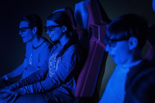 two men and a woman sitting on an airplane at The Kartrite Resort and Indoor Waterpark in Monticello