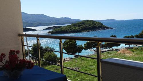 a balcony with a view of the ocean at Hotel Queen Margaret Seaside in Ksamil