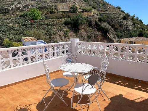 a patio with a table and chairs on a balcony at A867 - La Rodeta in Callosa de Ensarriá