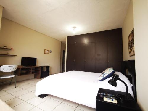 Cama o camas de una habitación en Apartamento mediano ideal para parejas o ejecutivos
