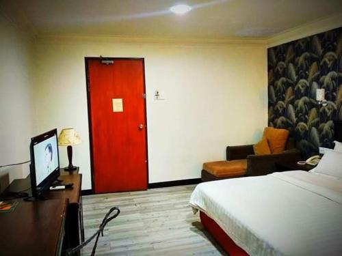 Cama o camas de una habitación en D'Borneo Hotel