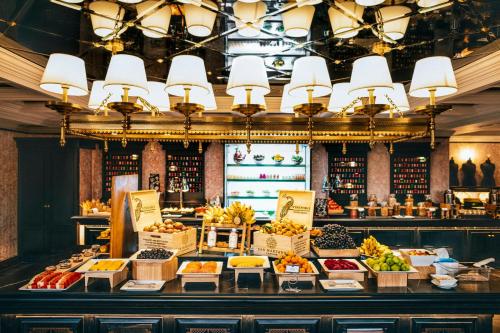 a display of fruits and vegetables in a store at Hotel de la Coupole - MGallery in Sa Pa