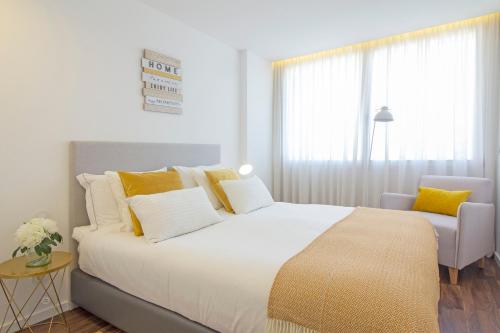 Oporto Ceuta Luxuryにあるベッド