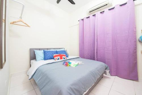 a bedroom with purple curtains and a bed at SetiaWalk {BIG GROUP}12Pax WIFI 2C'Park IOI SUNWAY SUBANG USJ in Puchong