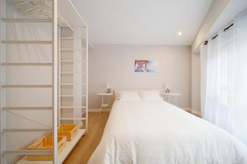 A bed or beds in a room at Centro-Nautico III