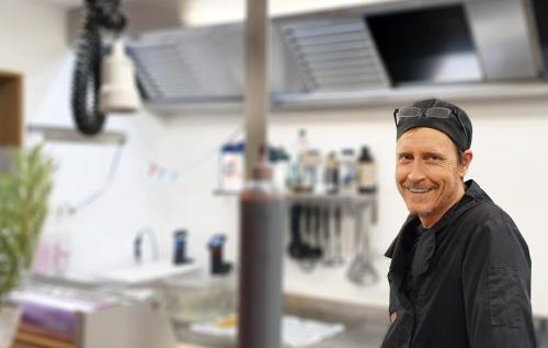 a man with a hat on his head in a store at Bodelssons by the Sea in Tosteberga
