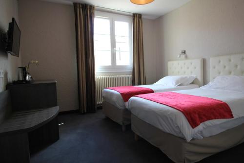 Postel nebo postele na pokoji v ubytování Hôtel Fesch & Spa