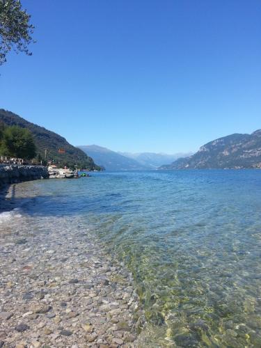 a rocky shore of a large body of water at Antico Pozzo Apartment in Bellagio