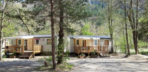 a cabin in the woods with a lot of trees at Les Acacias in Vercheny