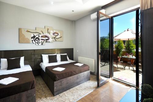 Postel nebo postele na pokoji v ubytování Hotel Marsel