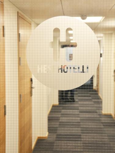 a staircase in a hallway with a sign that reads houston at HeseHotelli Turku Kaskentie in Turku