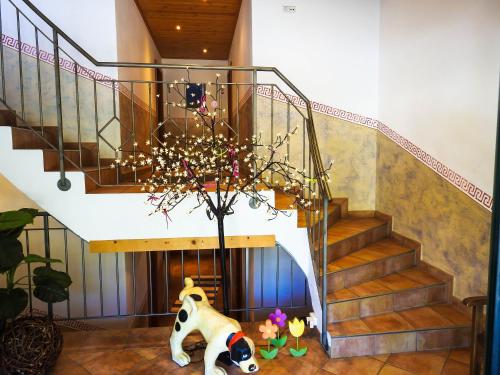 a room with a staircase with a panda bear and a plant at Ferienwohnung Julia in Brixen im Thale