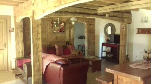 a living room with a couch and a table at Ker Cerdagne in Bolquere Pyrenees 2000