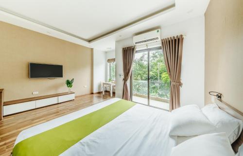 Gulta vai gultas numurā naktsmītnē Hana 1 Apartment & Hotel Bac Ninh