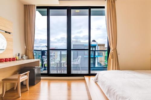 Postel nebo postele na pokoji v ubytování CHEN FENG HOMESTAY