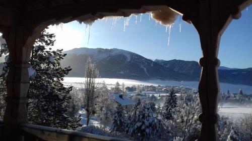 a view from a window with icicles hanging from it at Ker Capcir in Bolquere Pyrenees 2000