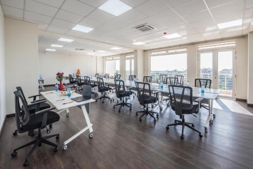 a large conference room with a long table and chairs at Glam Hotel Nairobi - Near Westgate Mall, Westlands in Nairobi