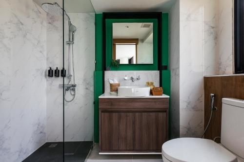 a bathroom with a sink and a shower at HOMM Boutique Hotel in Chiang Mai
