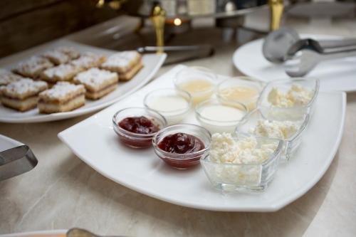 a white plate with different types of food on it at ART RAKAT in Tashkent