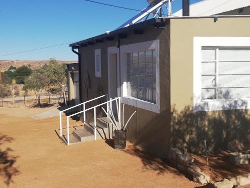 a side view of a house with a porch at Aloe Rock House in Aus