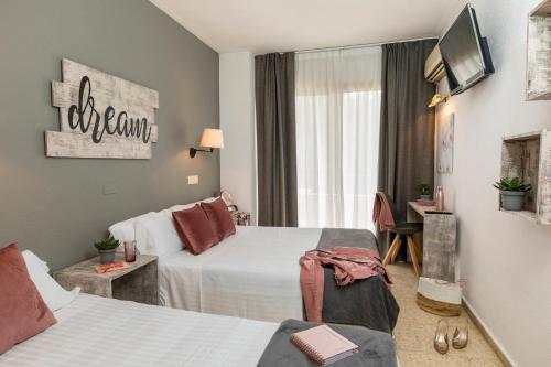 Postel nebo postele na pokoji v ubytování Hotel Bulevard