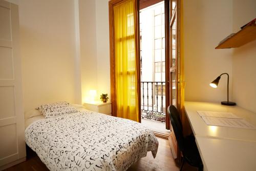 Ένα ή περισσότερα κρεβάτια σε δωμάτιο στο Hostel Palacio